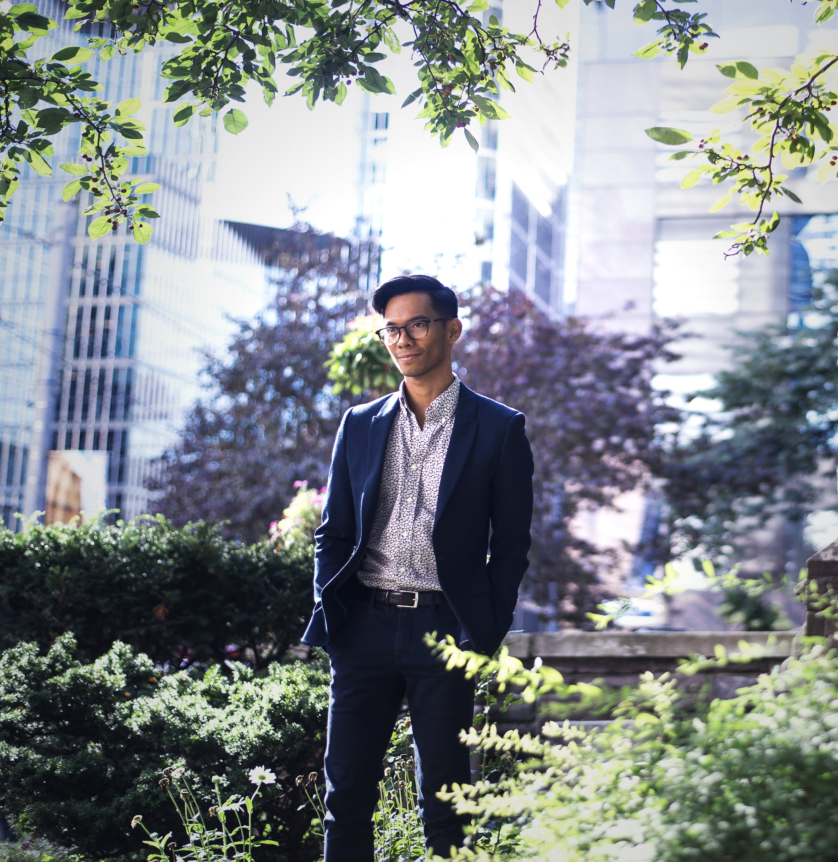 man in formal work suite in a garden